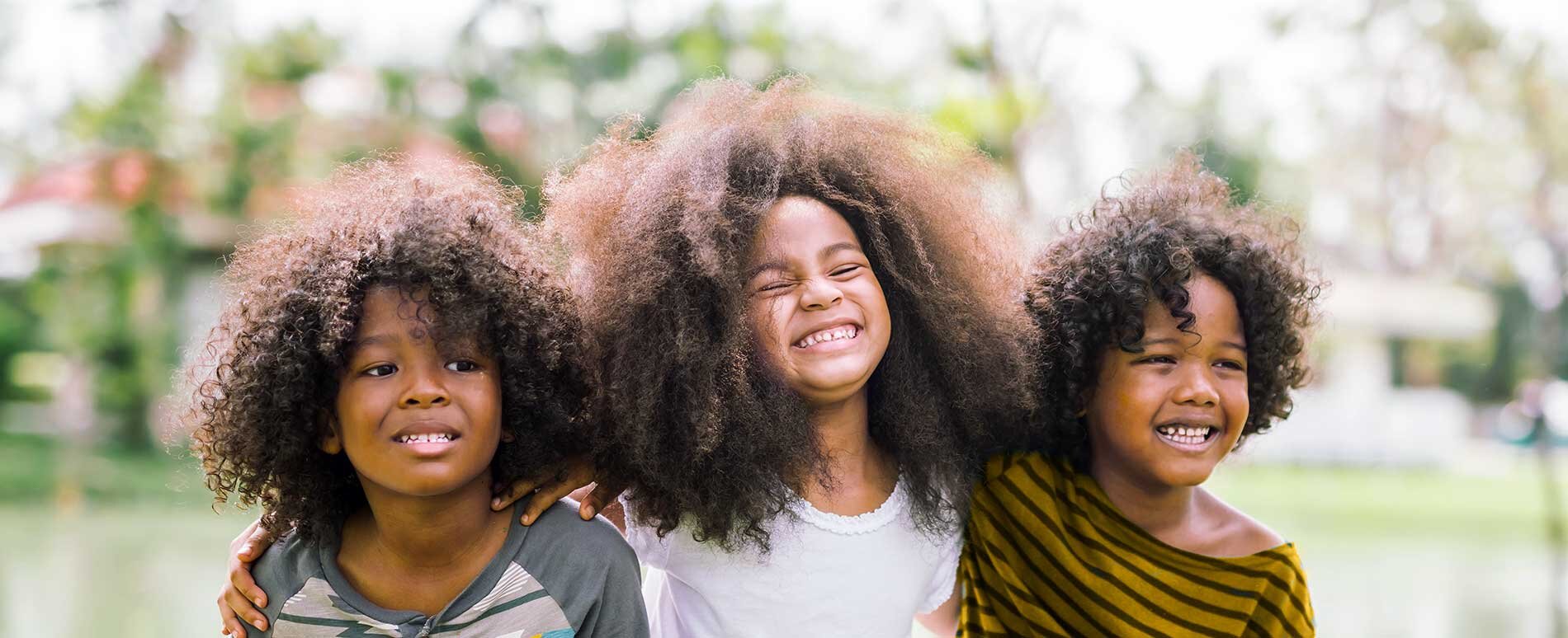 3 Children smiling outdoors